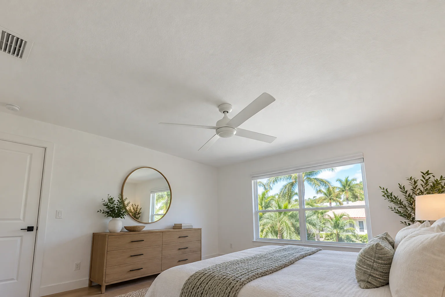 White bedroom ceiling with a fine orange-peel finish.