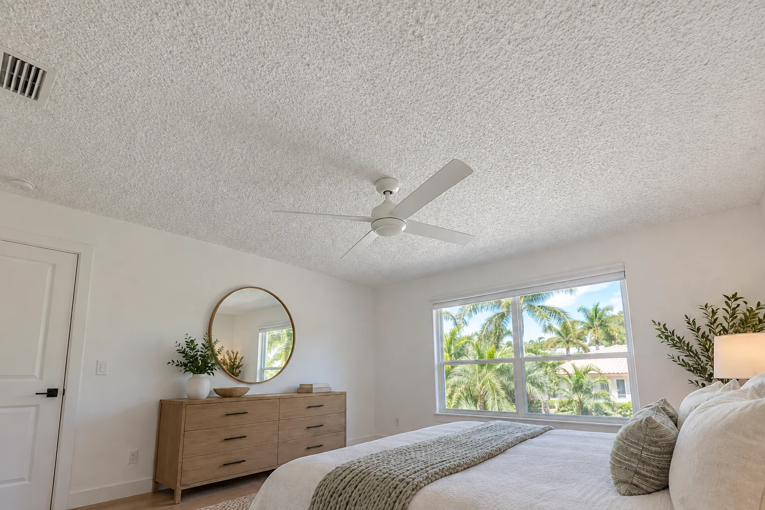 Second-floor bedroom ceiling with popcorn texture.