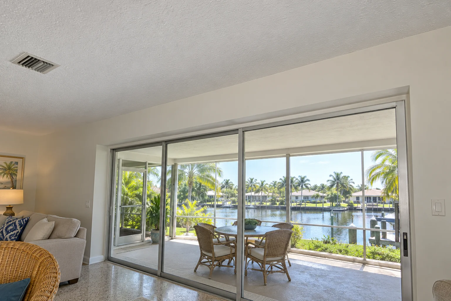 Clean painted ceiling above a lanai sliding door.